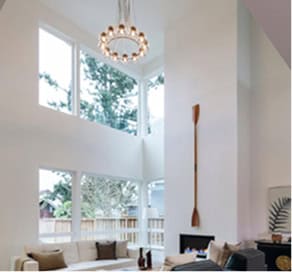 Bright living room with large windows in Fika community in Elgin, TX.