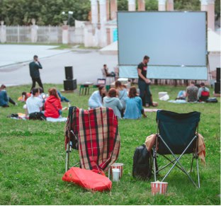Community members watching outdoor movie in Fika in Elgin, TX.