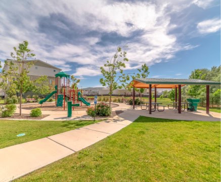 Community playground with slides and swings in Fika, Elgin TX.