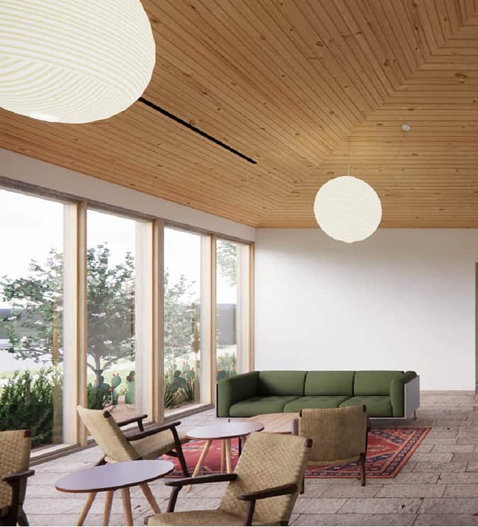 Community lounge with seating and large windows in Fika, Elgin TX.