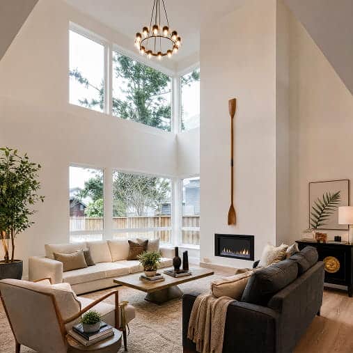 Bright living room with large windows and modern decor in Fika in Elgin, TX.
