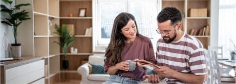 Couple reviewing documents in a Fika community home in Elgin, TX.