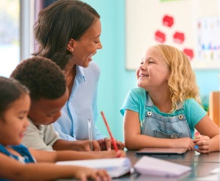 Teacher and children in classroom at Fika in Elgin, TX.