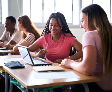 Students studying together in a classroom at Fika in Elgin, TX.