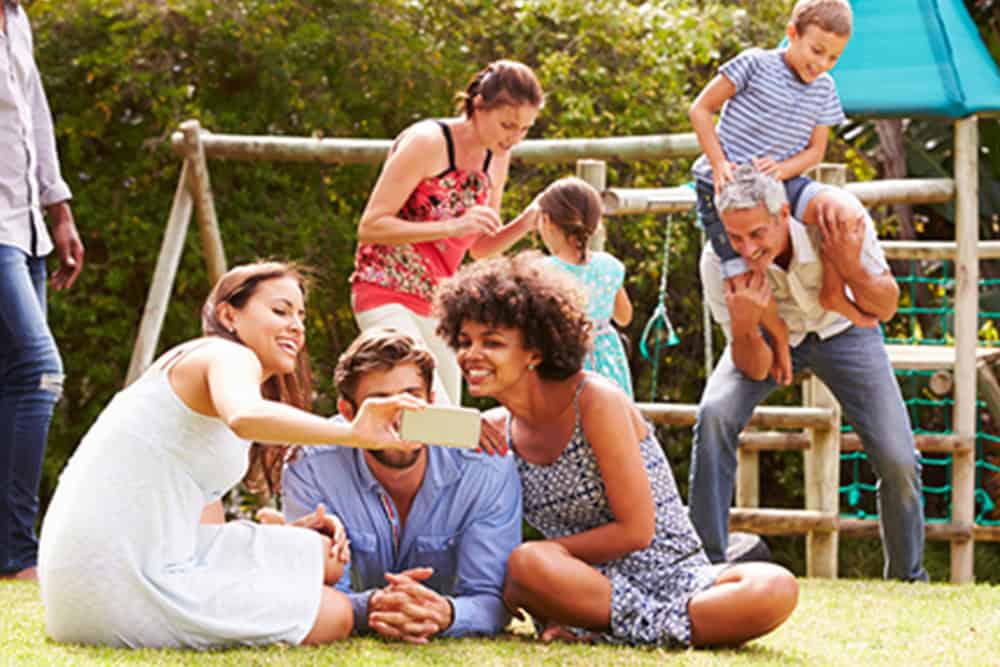 Family and friends enjoying a picnic in a park at Fika in Elgin, TX.