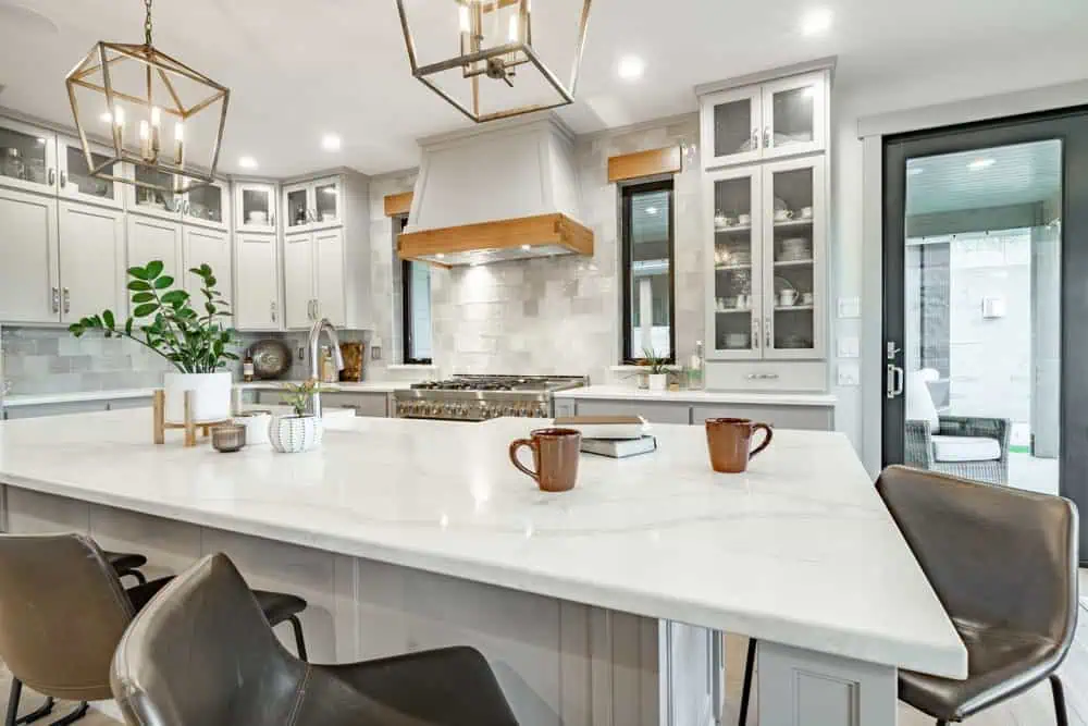 Modern kitchen with island and cabinetry in Fika community in Elgin, TX.