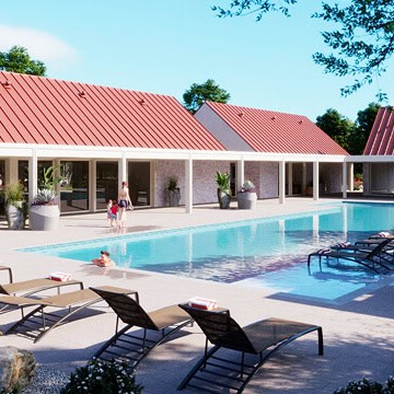 Community pool with lounge chairs and a building in the background in Fika.
