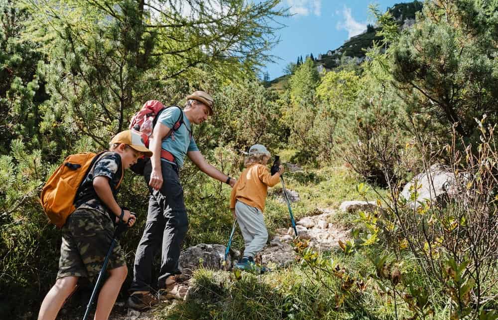 Family hiking on a trail in Fika community in Elgin, TX.